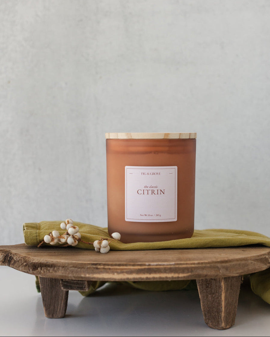 Ginger Lime candle by Fig & Grove, featuring a minimalist label and natural soy wax, with calming scents of ginger and lime essential oils.