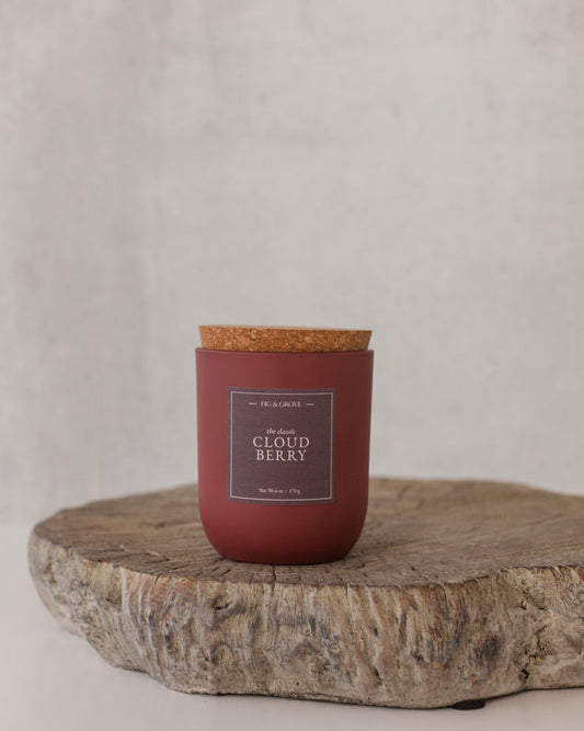 Cloudberry candle in umber glass jar evoking snowy forest freshness – Fig & Grove