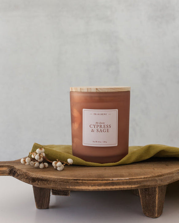 Earthy Cypress & Sage soy candle in 10 oz jar with palo santo and patchouli