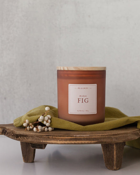 Fig candle in brown glass jar with white berries, evoking sweet figs and warm spices – Fig & Grove