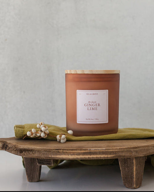 Ginger Lime candle by Fig & Grove, featuring a minimalist label and natural soy wax, with calming scents of ginger and lime essential oils.