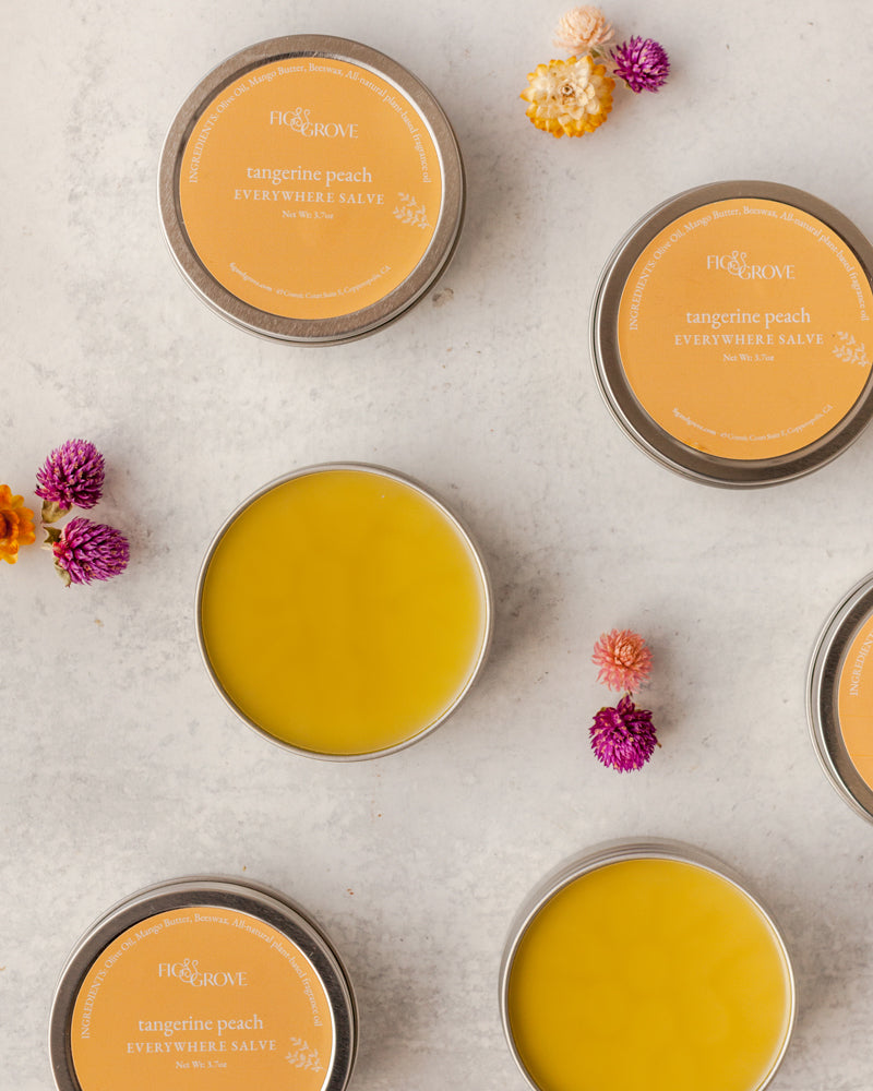 Fig & Grove Tangerine Peach Everywhere Salve in a metal tin, natural moisturizing skin balm.