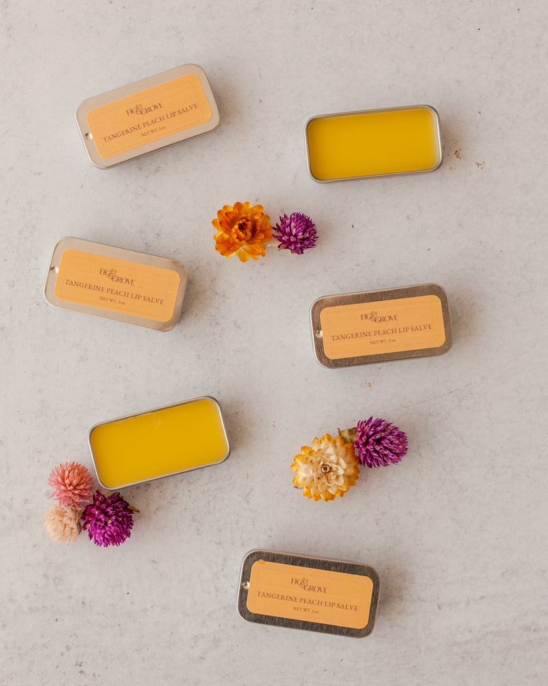 Fig & Grove Tangerine Lip Salve in aluminum tin, natural beeswax lip balm with olive oil and mango butter.