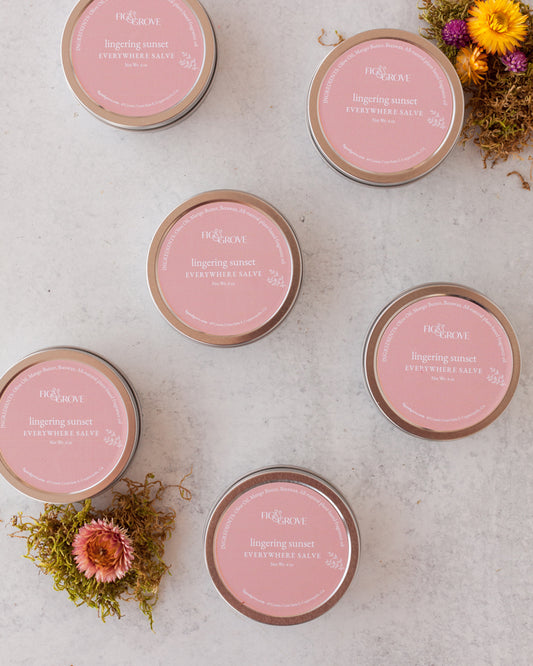 Fig & Grove Lingering Sunset Everywhere Salve in a metal tin, natural moisturizing skin balm.