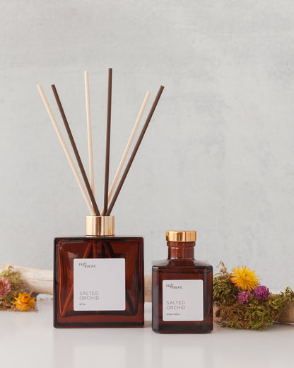 Fig & Grove Salted Orchid reed diffuser with soft floral, sea salt, amber, and tonka notes